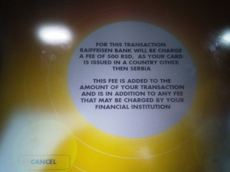 ATM Fee Warning on a Raiffeisen Bank ATM in Serbia