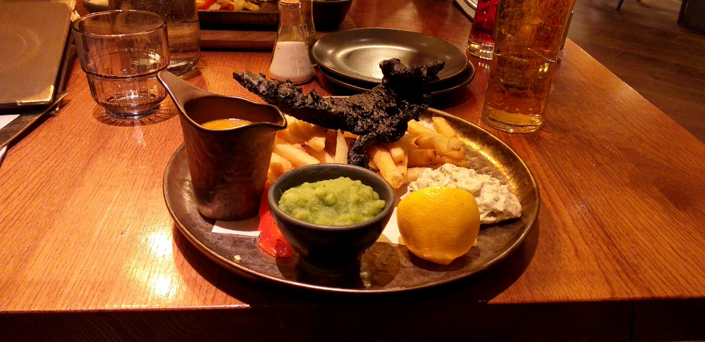 Black Fish and Chips at the Alchemist in Eldon Square, Newcastle-upon-Tyne. The fish isn't burnt. It's meant to look that way.
